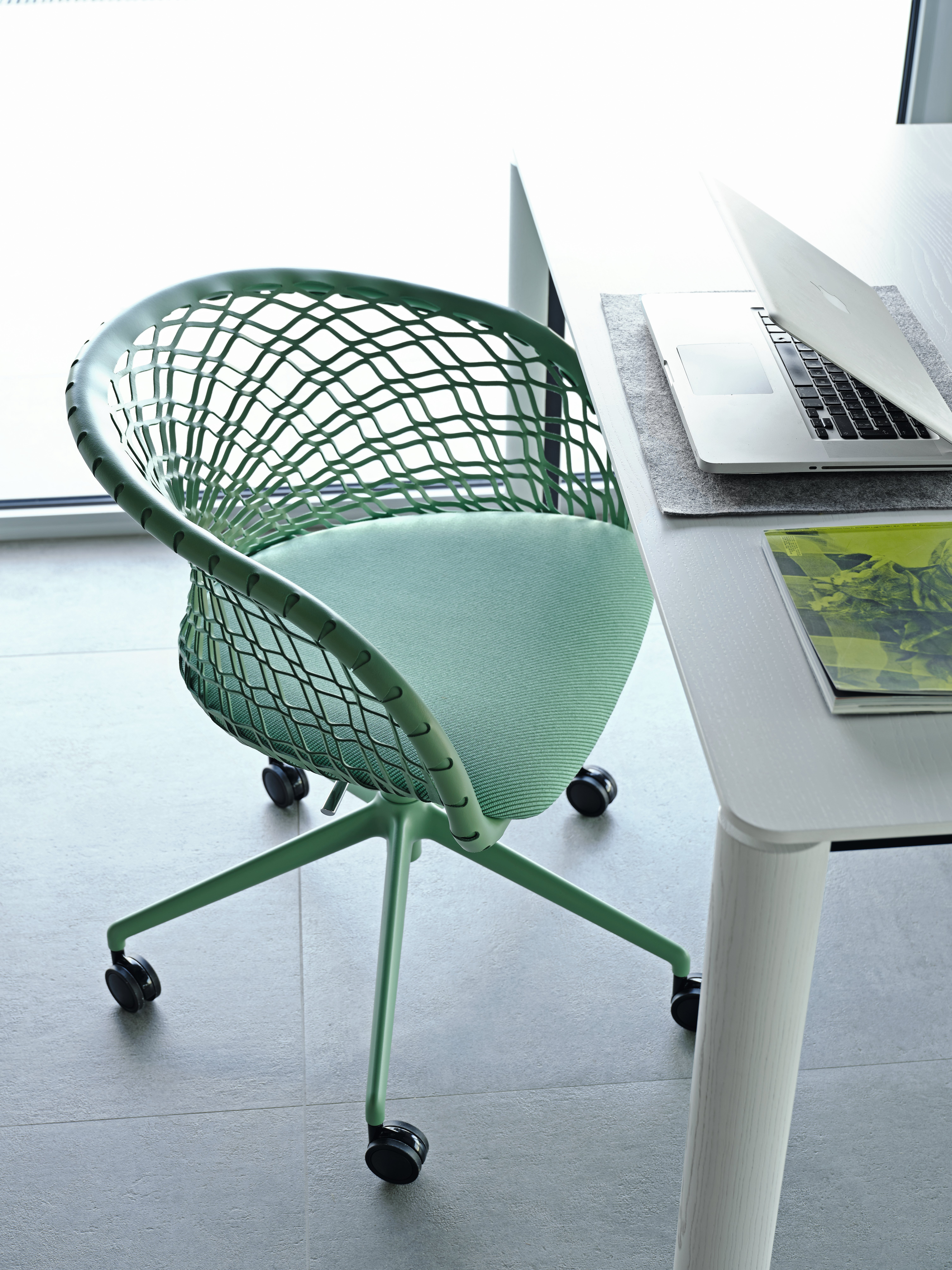 p47 task chair on weels in green leather