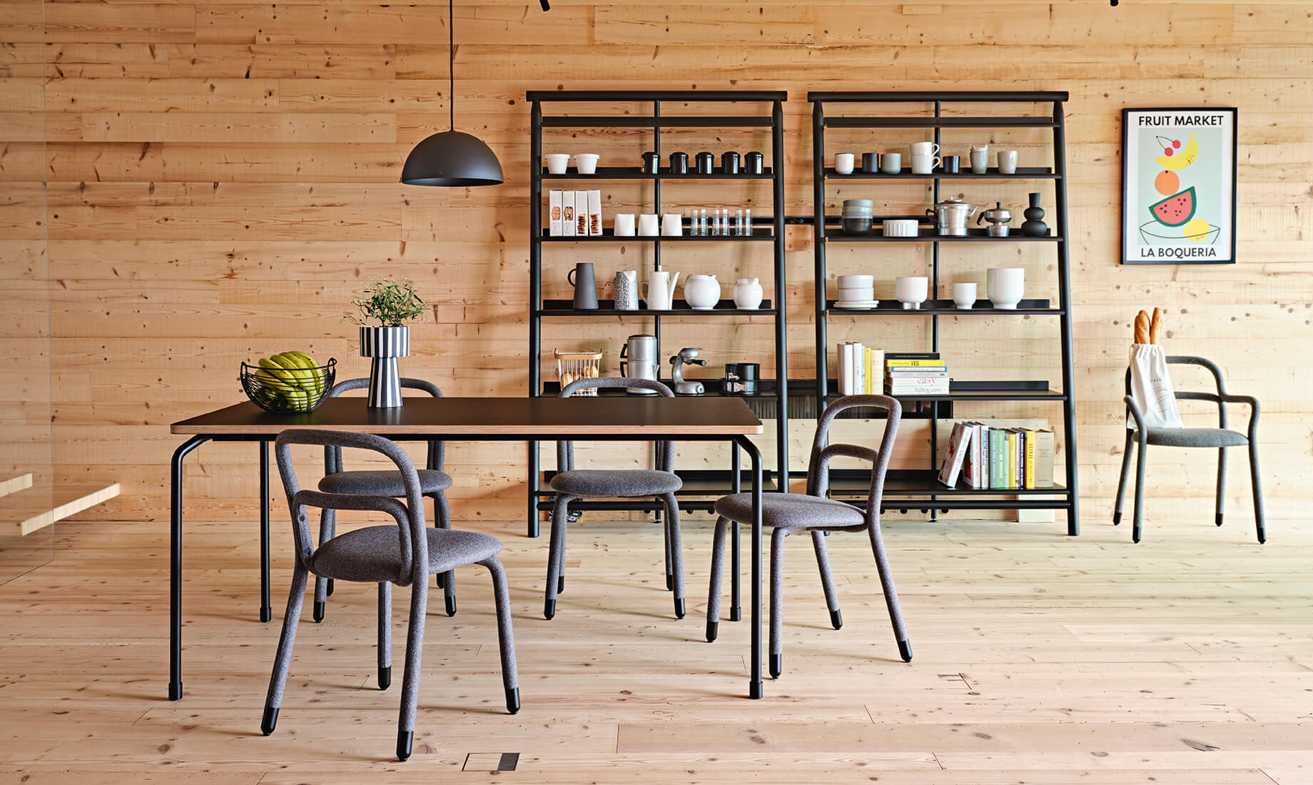 Master table, design Paolo Vernier, with Pippi chairs, design Roberto Paoli, and Suite bookcase, design AtelierNanni.