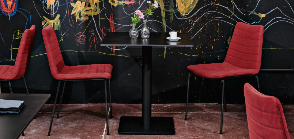 Cover stackable bar chair with black metal legs and upholstered seat