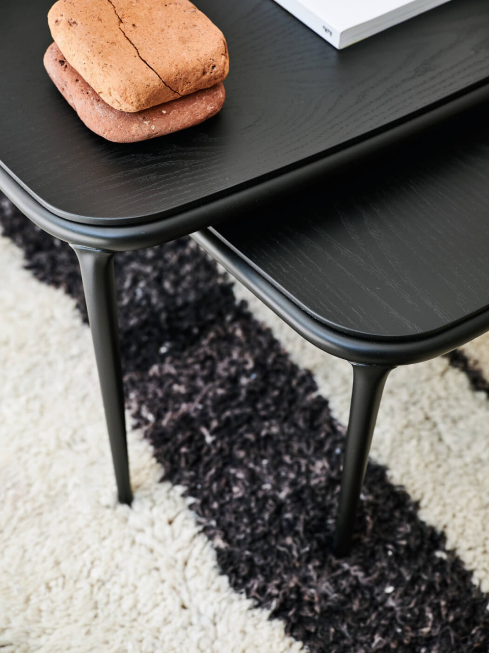 Detail of black wooden top of Lea coffe tables