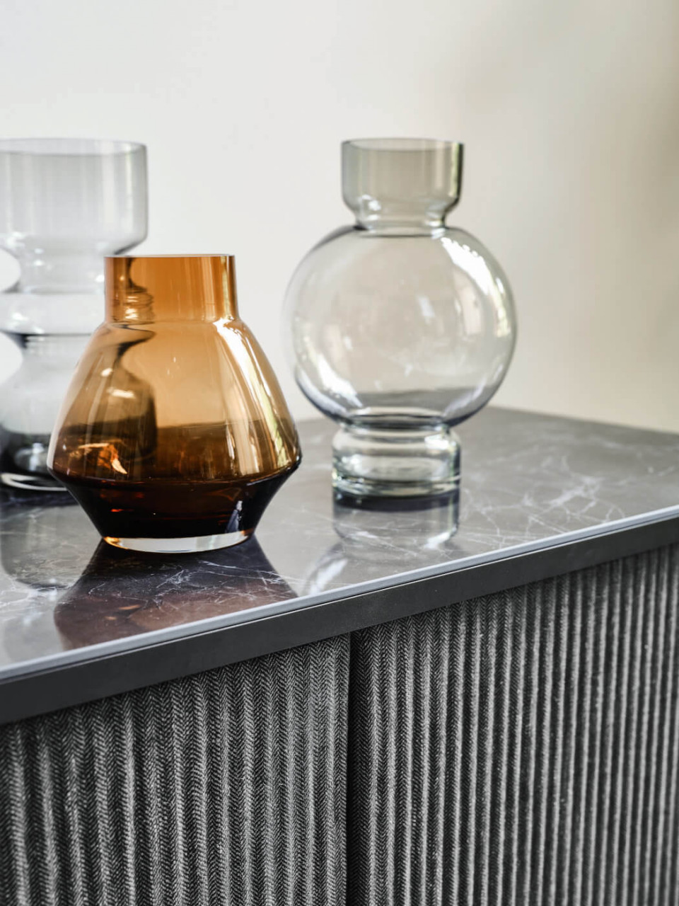 Detail of the marble-effect ceramic top of the Lea sideboard