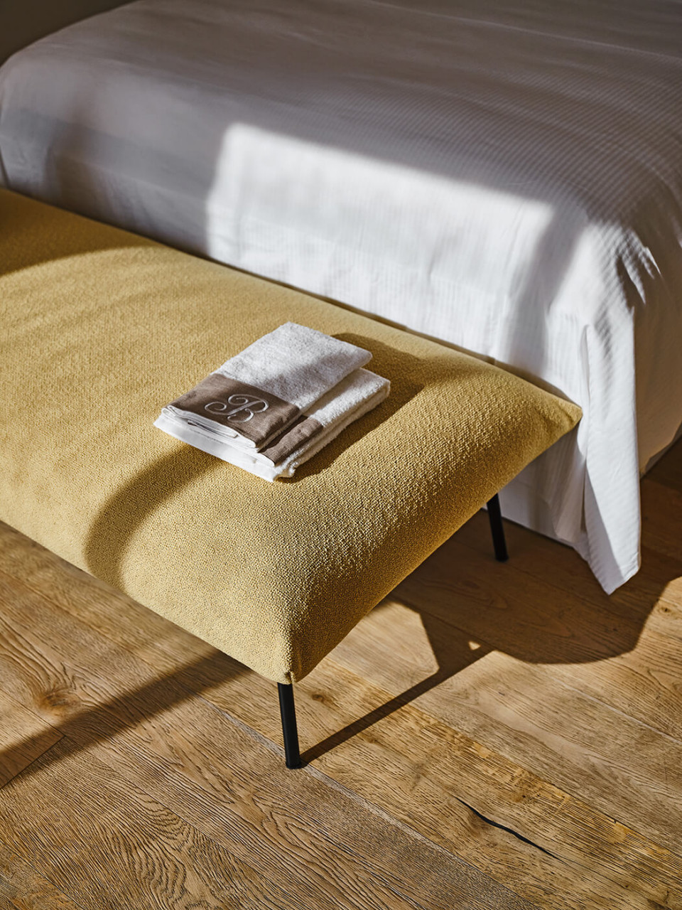 Area pouf with yellow fabric