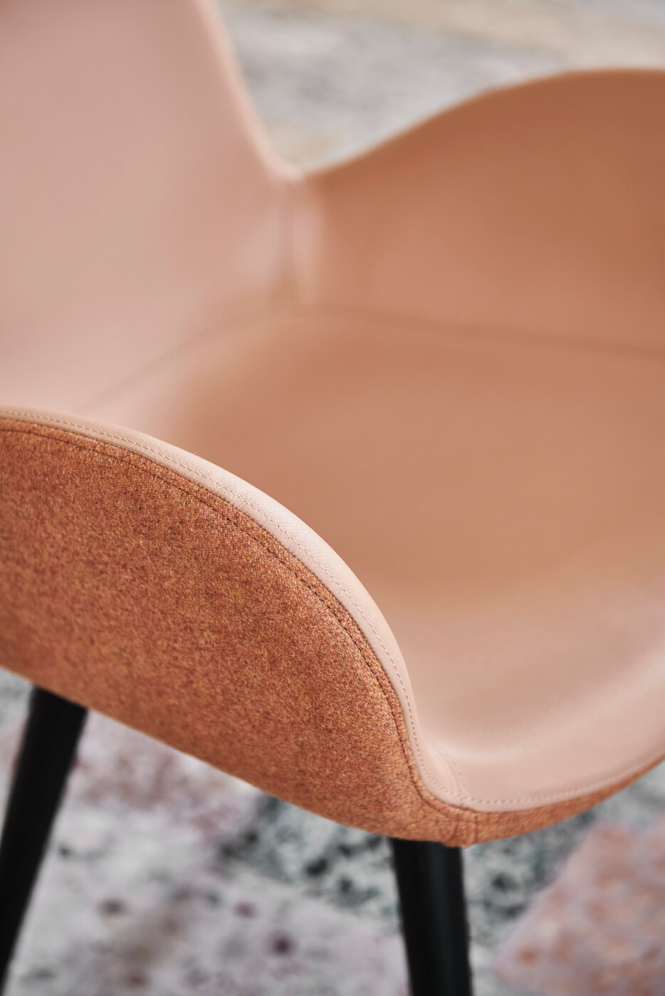 Detail of Dalia armchair with seat in fabric and pink hide