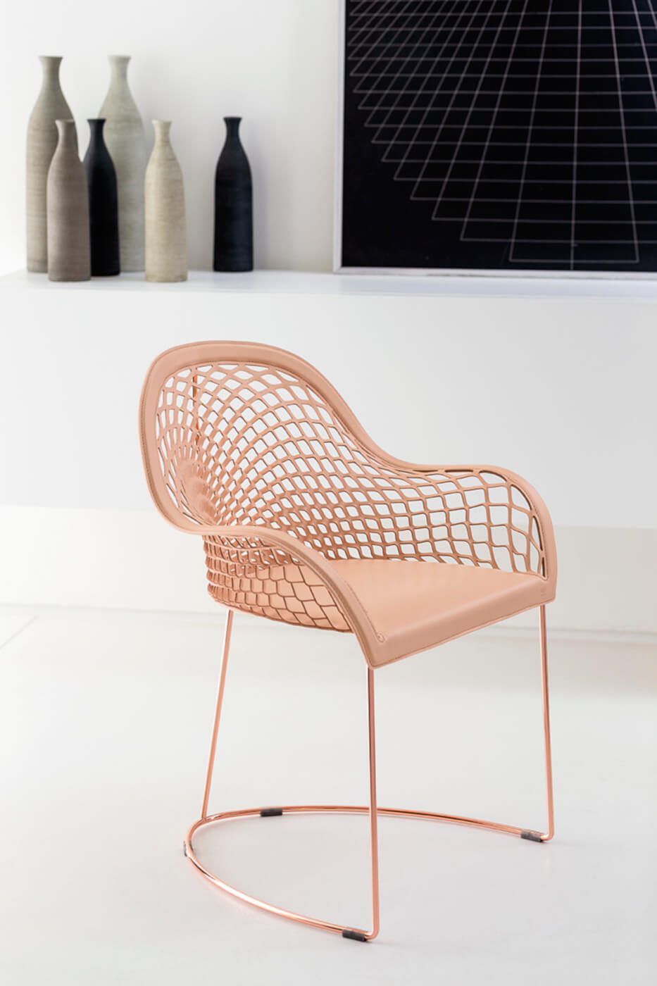 Guapa armchair with rose gold-finished metal frame and pink hide seat