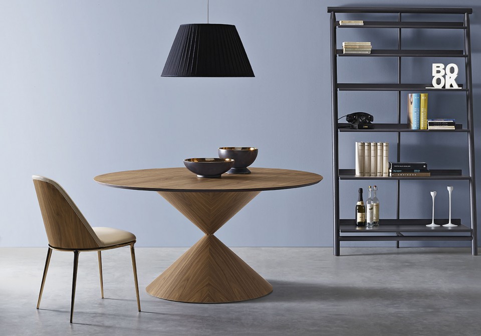 Lea chair with legs in golden bronze finish, seat upholstered in leather and wooden back face