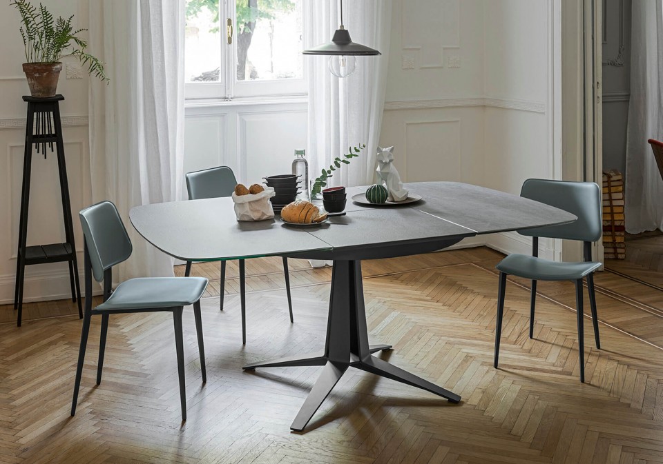 Link extendable table with central base in graphite metal and barrel top in cristalceramic with Savoy stone effect