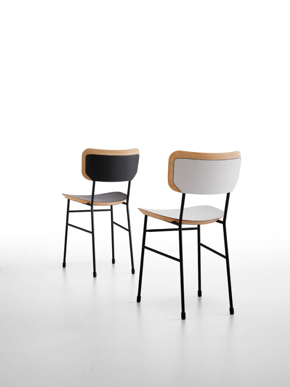 Master chair with black and white wood seat and metal structure