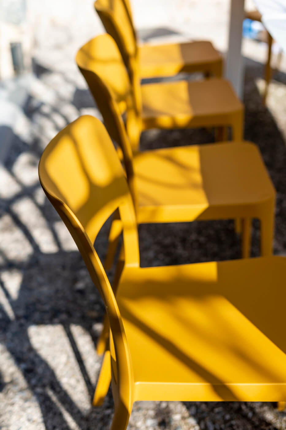 Detail of the seat of the Nenè chair, in ocher polypropylene