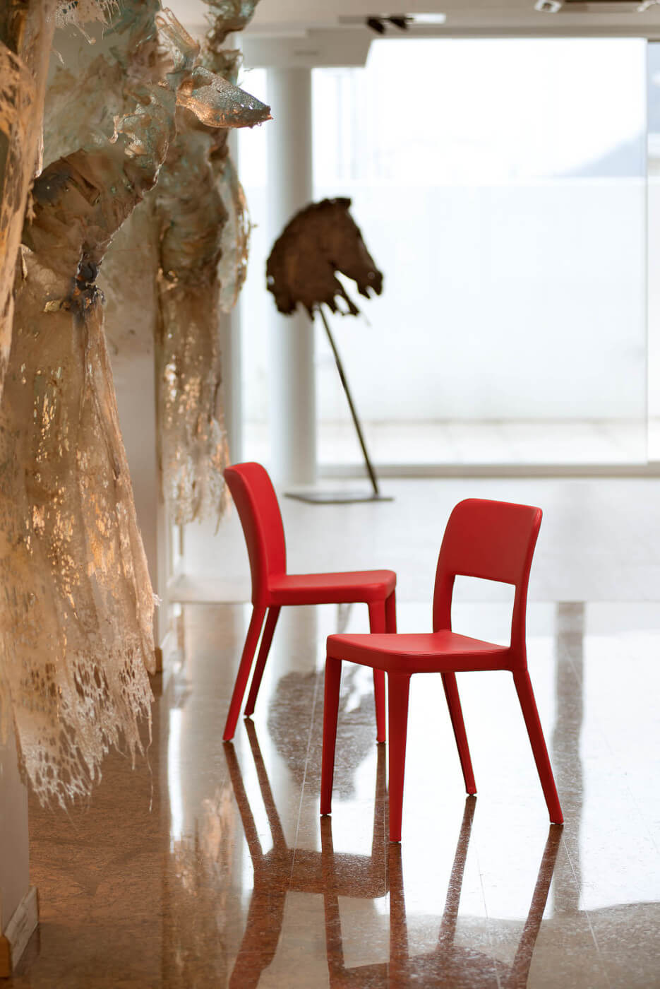 Nenè chair with four legs structure and covered in fabric