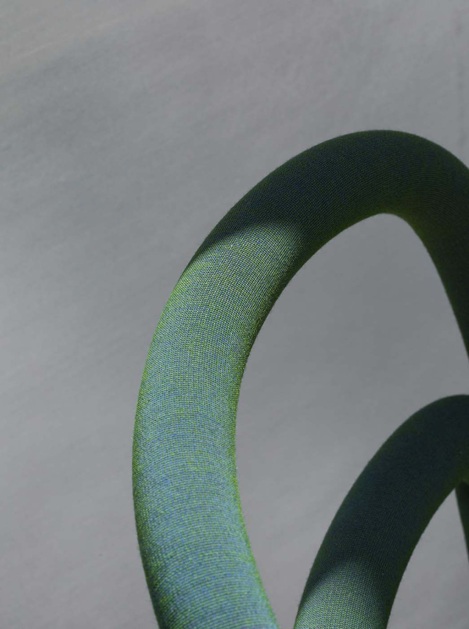 Detail ofgreen uniform melange fabric on Pippi chair