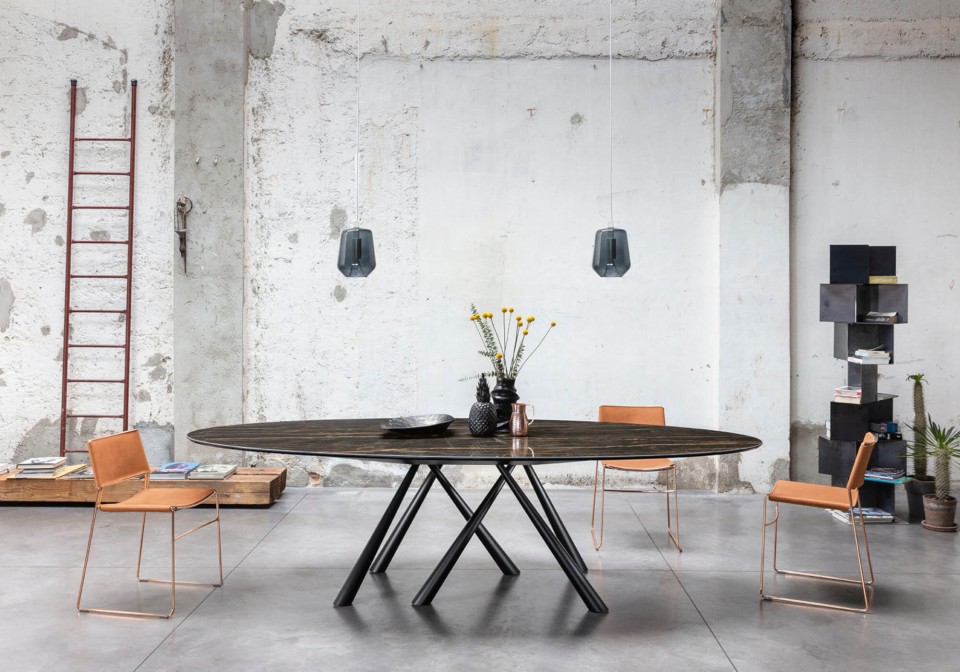 Slim table chair with pink hide seat and rose gold painted metal structure
