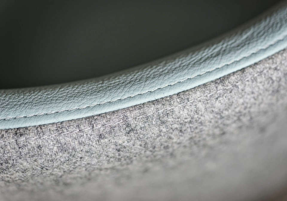 Detail of Sonny seat with back shell in gray fabric and seat in light blue leather