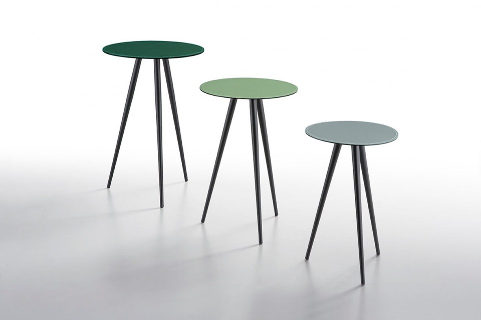 Complete collection of Trip coffee tables with black metal base and green leather tops in different shades