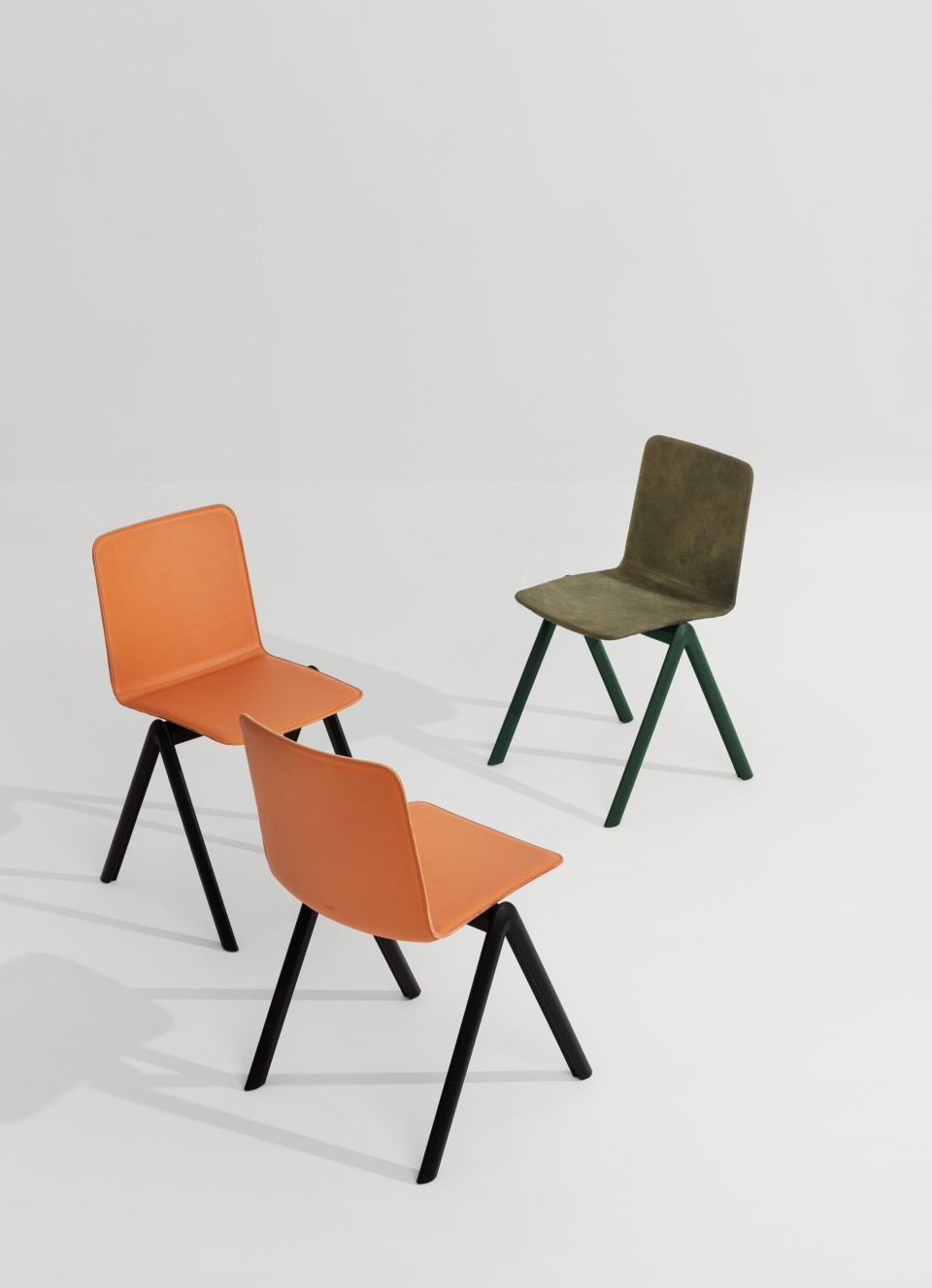 Stack stackable chair with four-legs base in polypropylene with shell upholstered in hide MIDJ