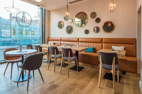 Sonny chairs with wooden legs and Joe chairs with wooden legs in the M Cafè of the Hotel Indigo in Manchester