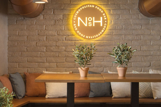 Nosh – Cosmopolitan Food & Bar furnished with Midj's Montera chairs, Composit tables, Apelle coat rack