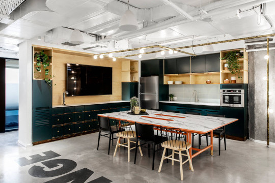 Wooden Strike chairs in the lounge area of Rooms co-working